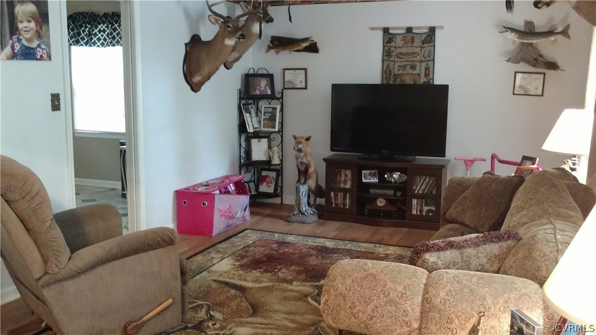 2383 Sizer Road Beaverdam, VA 23015 - Photo 17 of 29 a living room with furniture and a flat screen tv