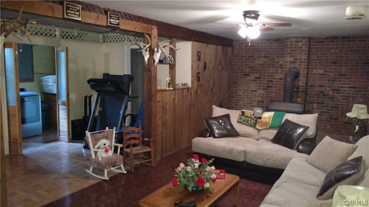 2383 Sizer Road Beaverdam, VA 23015 - Photo 26 of 29 a living room with furniture and a chandelier