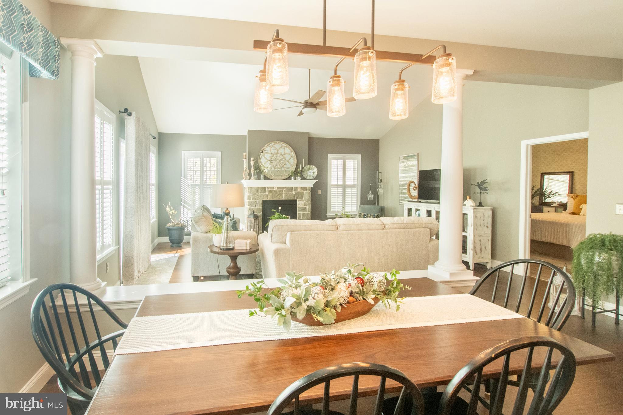 1247 South Red Maple Way Downingtown, PA 19335 - Photo 18 of 32 a view of a dining room and livingroom with furniture a chandelier and wooden floor