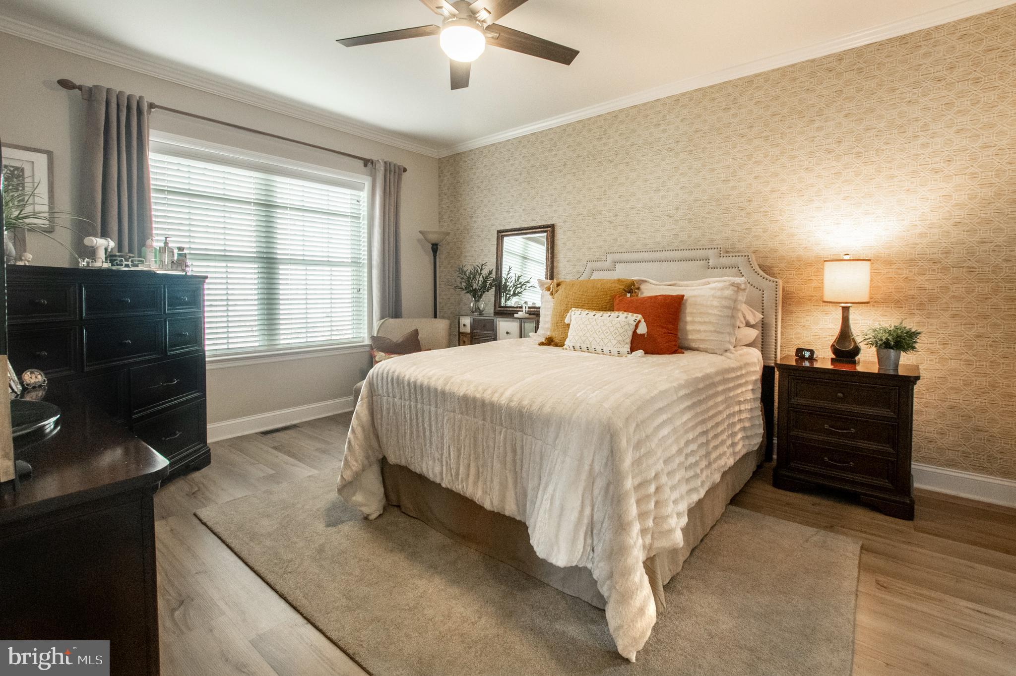 1247 South Red Maple Way Downingtown, PA 19335 - Photo 22 of 32 a spacious bedroom with a bed and a flat screen television