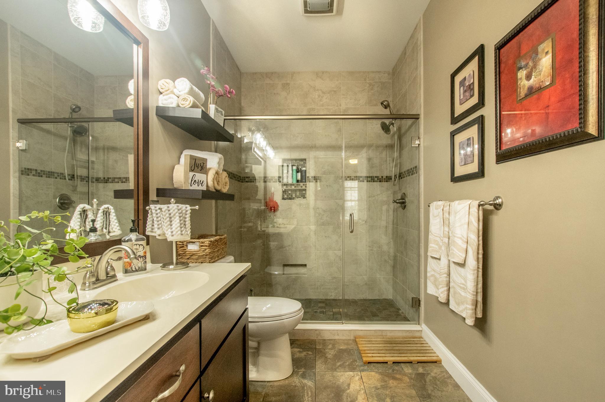 1247 South Red Maple Way Downingtown, PA 19335 - Photo 26 of 32 a bathroom with a granite countertop sink toilet and shower