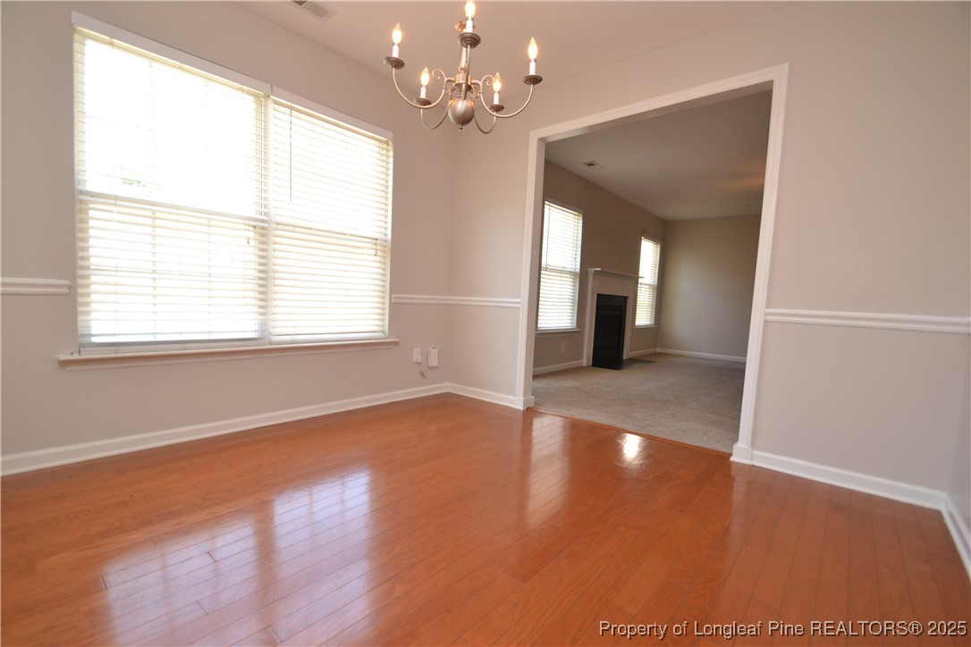 1428 Cricket Ridge Drive Raleigh, NC 27610 - Photo 14 of 47 a view of a room with wooden floor and window
