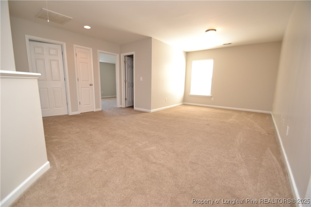 1428 Cricket Ridge Drive Raleigh, NC 27610 - Photo 19 of 47 a view of an empty room with a window