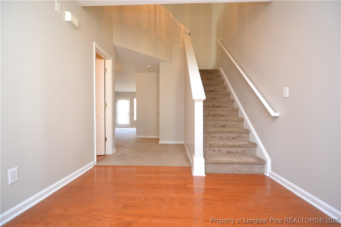 1428 Cricket Ridge Drive Raleigh, NC 27610 - Photo 2 of 47 a view of entryway and hall with wooden floor