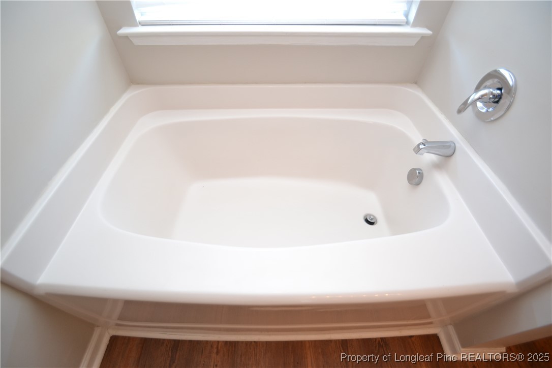 1428 Cricket Ridge Drive Raleigh, NC 27610 - Photo 29 of 47 a bathroom with a bathtub