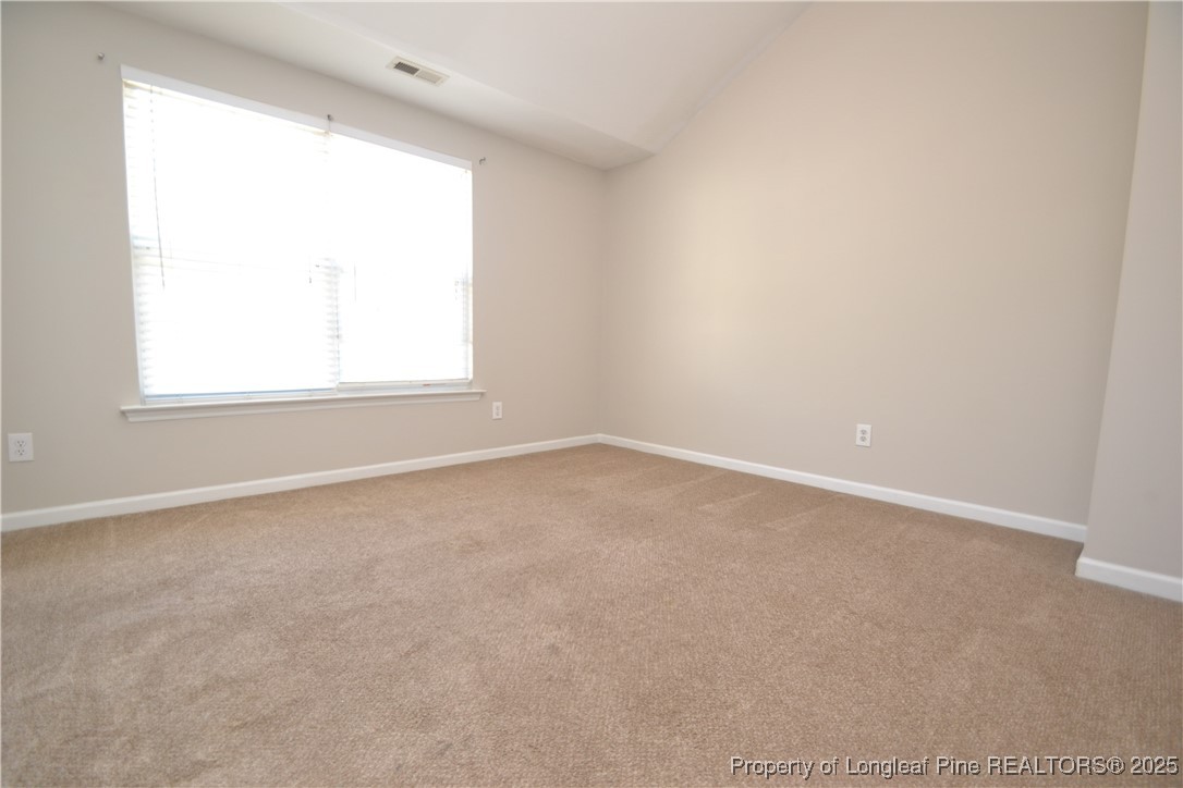 1428 Cricket Ridge Drive Raleigh, NC 27610 - Photo 40 of 47 an empty room with a window