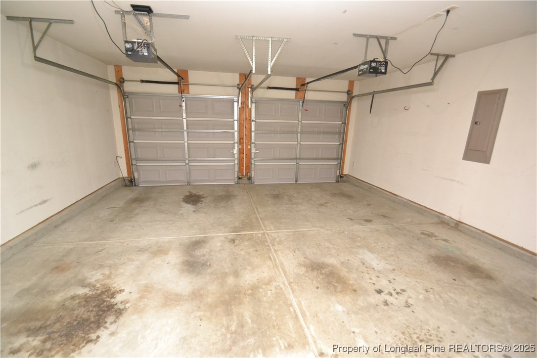 1428 Cricket Ridge Drive Raleigh, NC 27610 - Photo 44 of 47 a view of room with racks on the wall