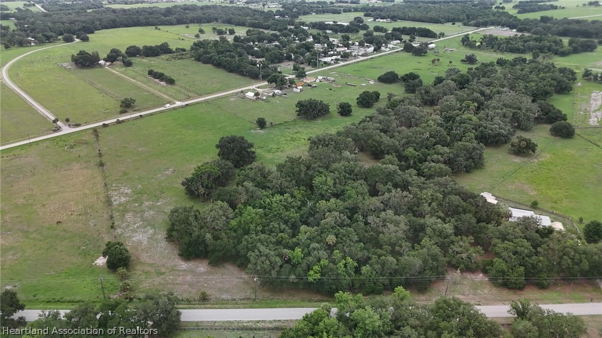 Popash Road Wauchula, FL 33873 - Photo 10 of 29 an aerial view of a residential houses with outdoor space and trees all around