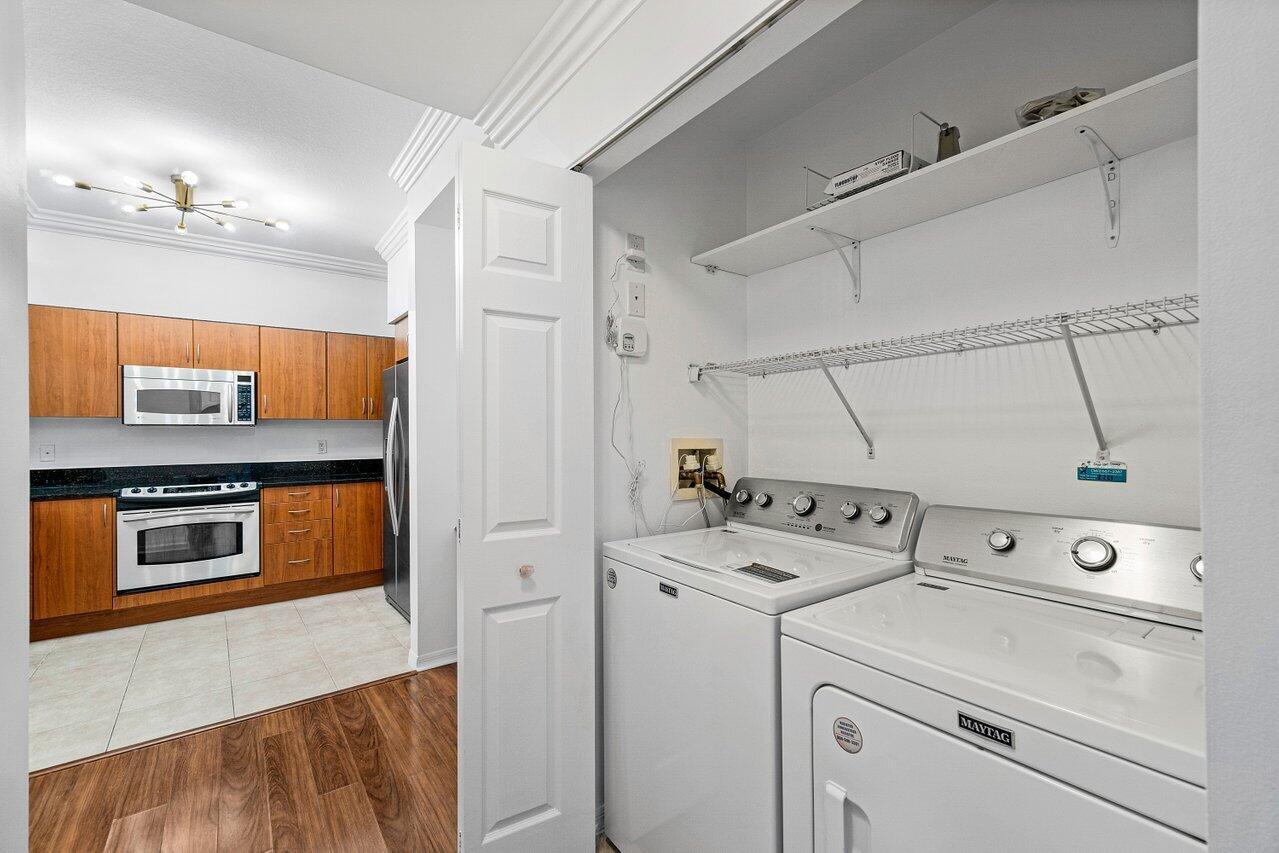 233 South Federal Highway, Unit 410 Boca Raton, FL 33432 - Photo 12 of 50 a utility room with dryer and washer