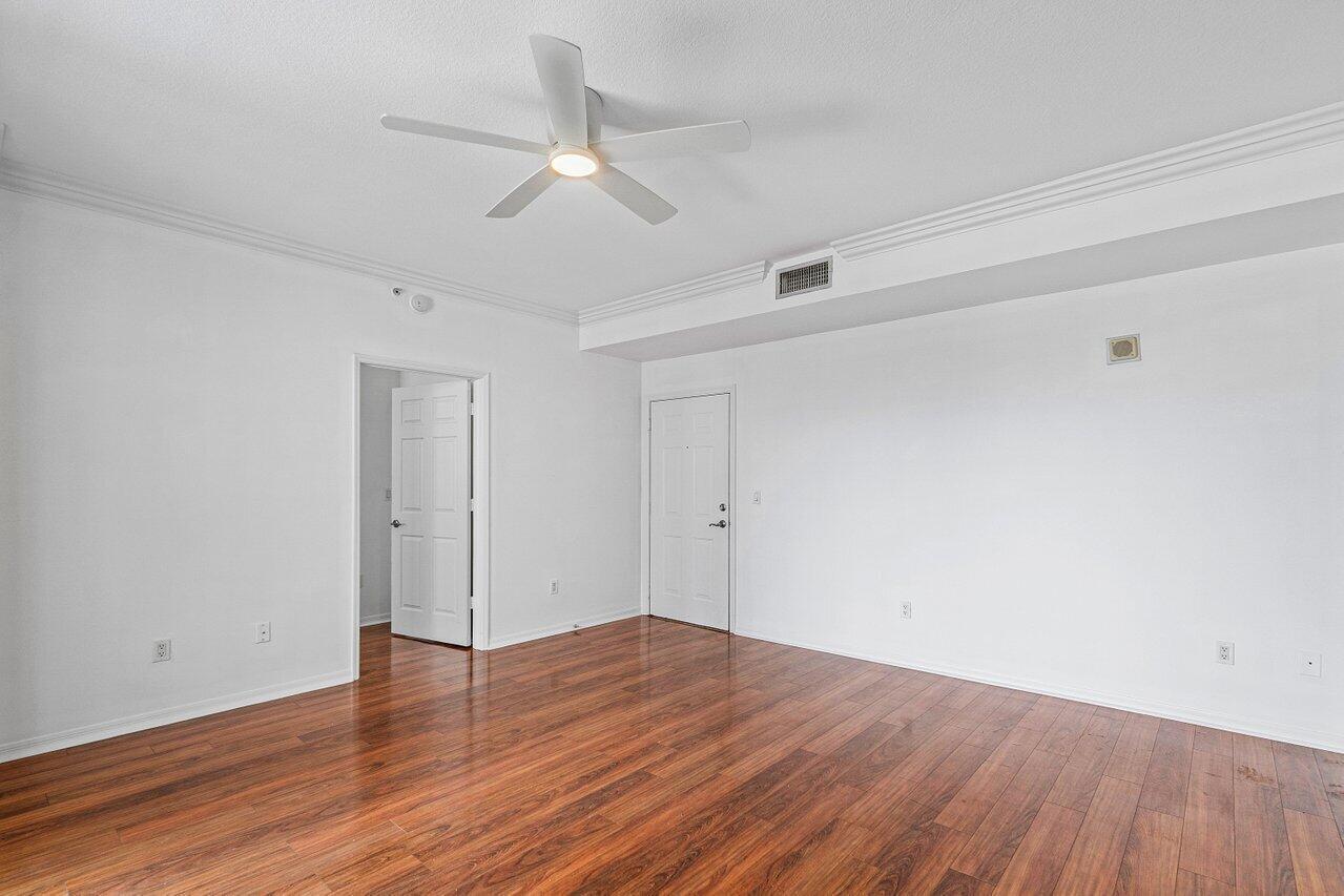 233 South Federal Highway, Unit 410 Boca Raton, FL 33432 - Photo 13 of 50 a view of an empty room with wooden floor