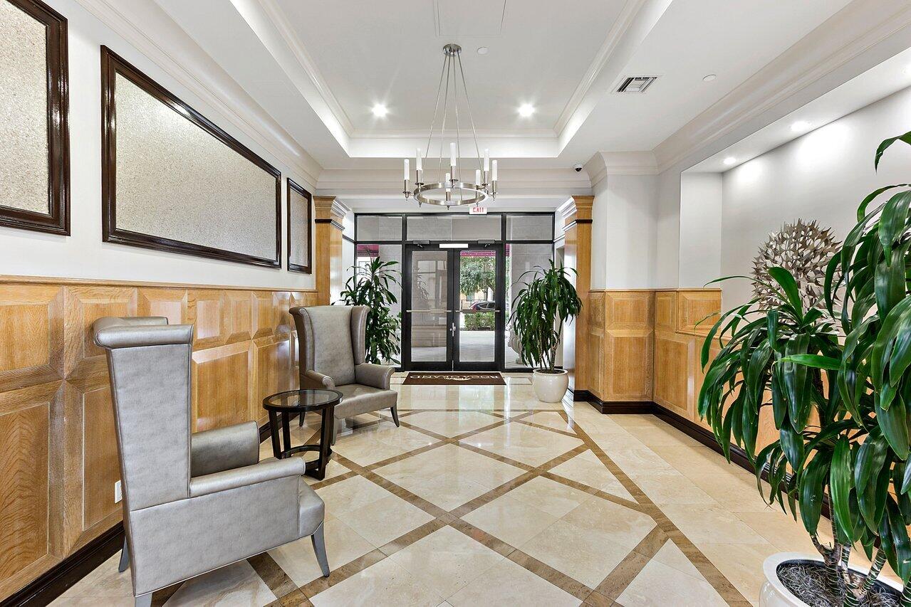 233 South Federal Highway, Unit 410 Boca Raton, FL 33432 - Photo 24 of 50 a view of a livingroom with furniture and floor to ceiling window