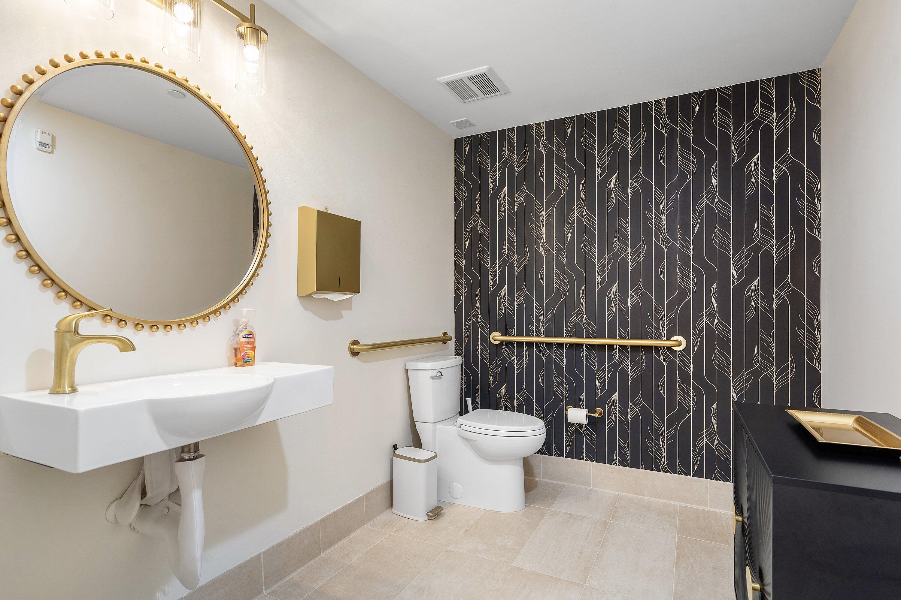 233 South Federal Highway, Unit 410 Boca Raton, FL 33432 - Photo 32 of 50 a bathroom with a sink a mirror a toilet and a window