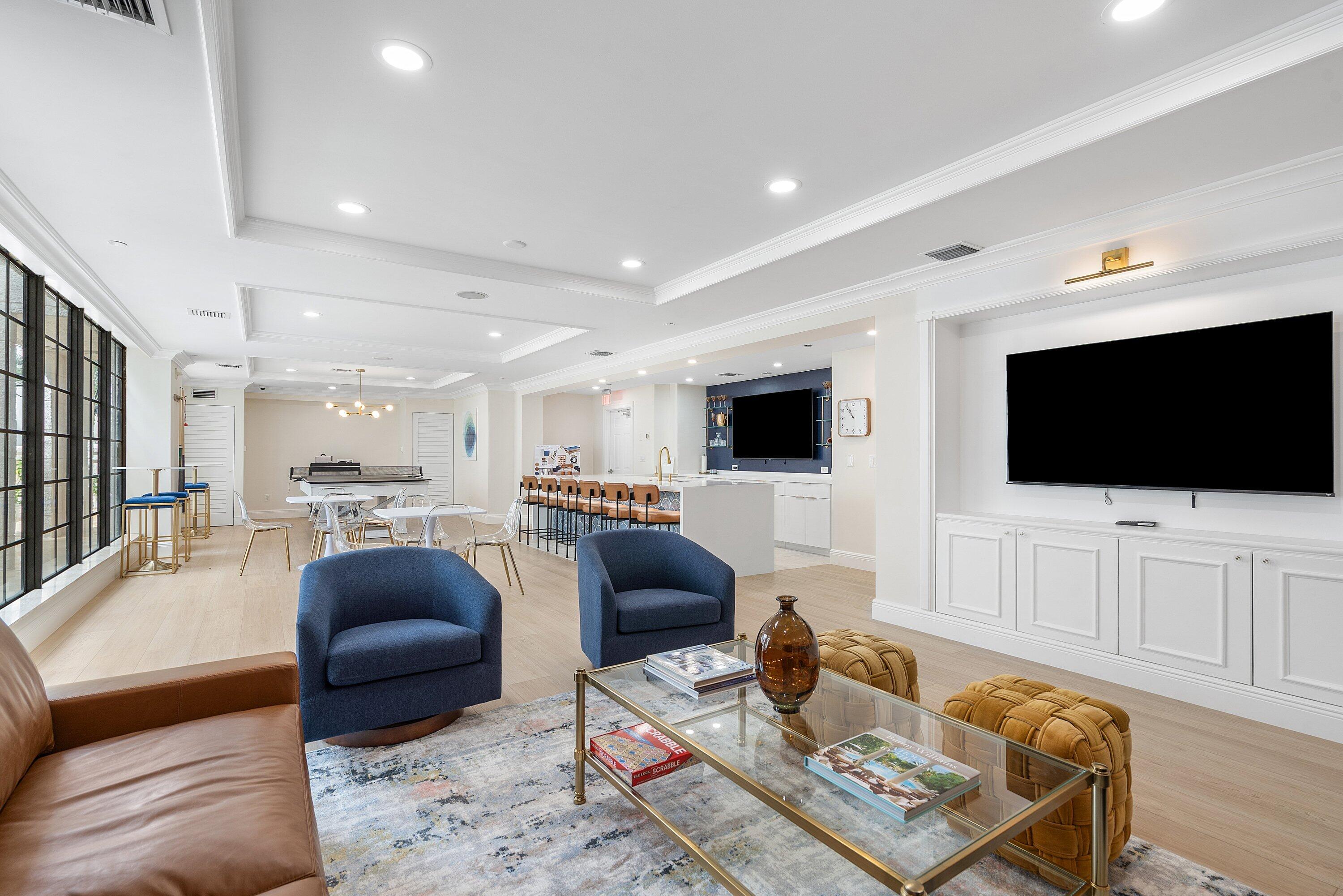233 South Federal Highway, Unit 410 Boca Raton, FL 33432 - Photo 33 of 50 a living room with furniture and a flat screen tv