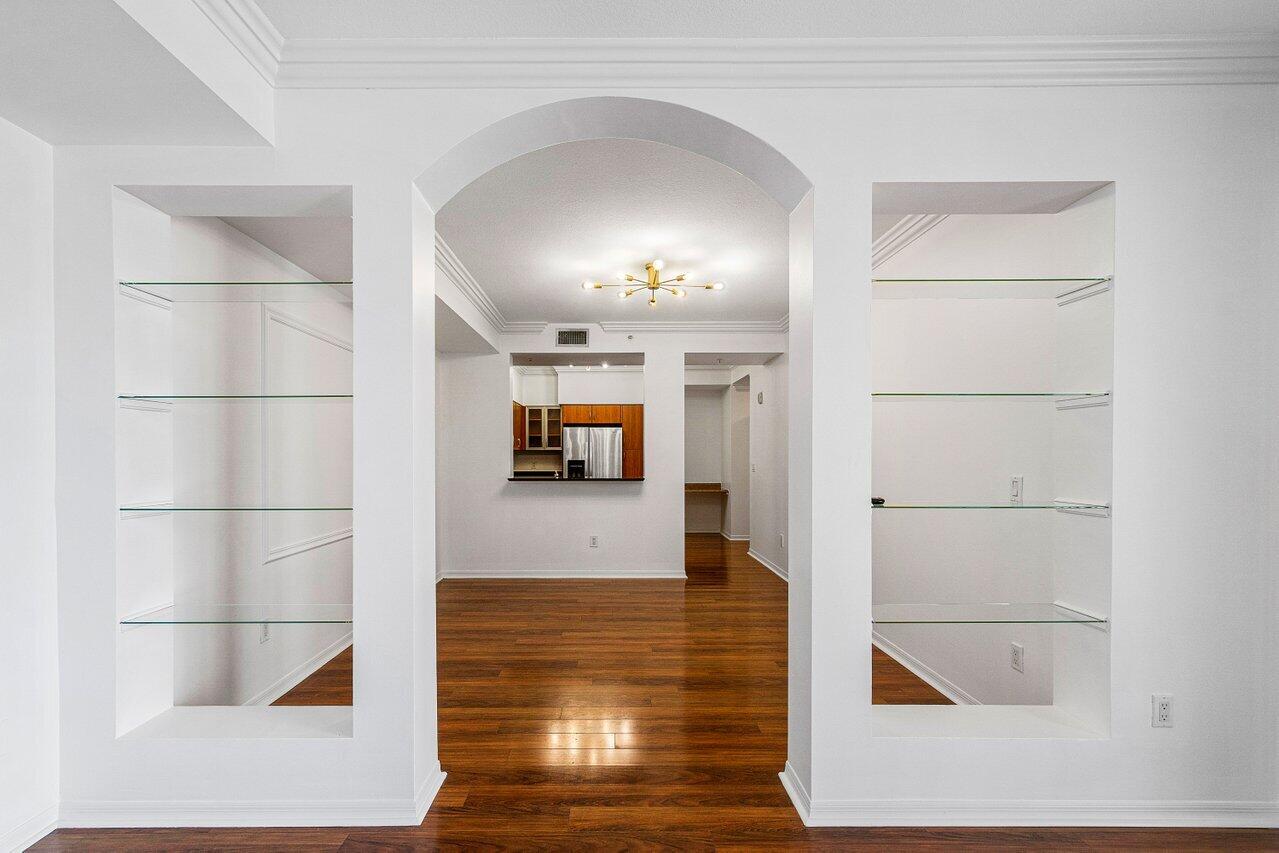 233 South Federal Highway, Unit 410 Boca Raton, FL 33432 - Photo 10 of 50 a view of a hallway with wooden floor and cabinet