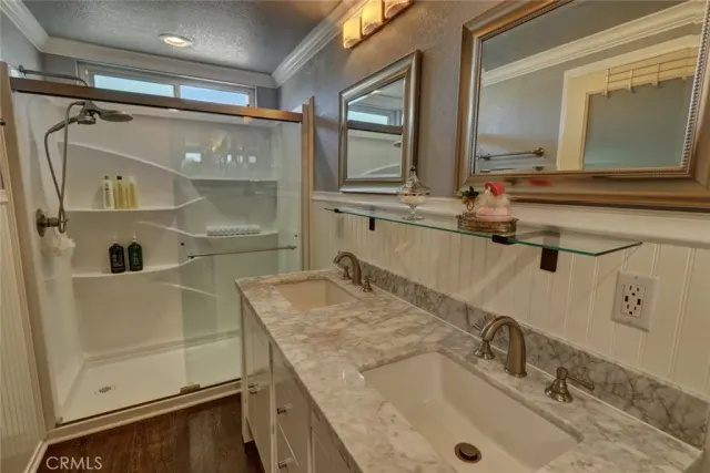 a bathroom with a granite countertop sink mirror and double