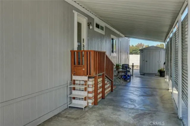 an empty room with wooden floor and a window