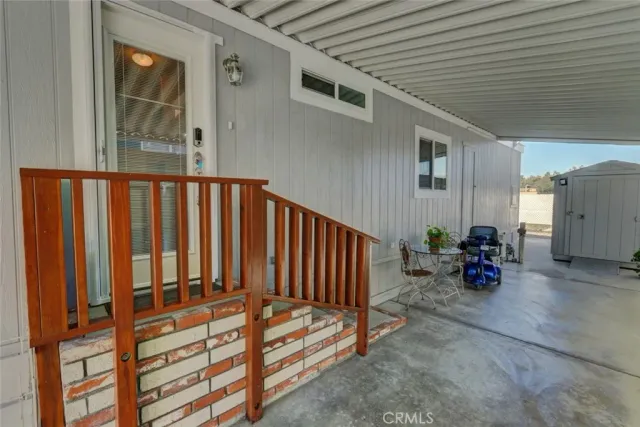 a backyard of a house with yard and outdoor seating