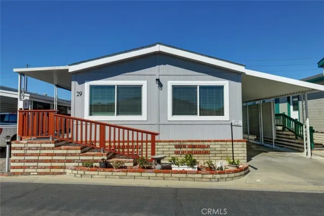 a front view of house with yard and outdoor seating