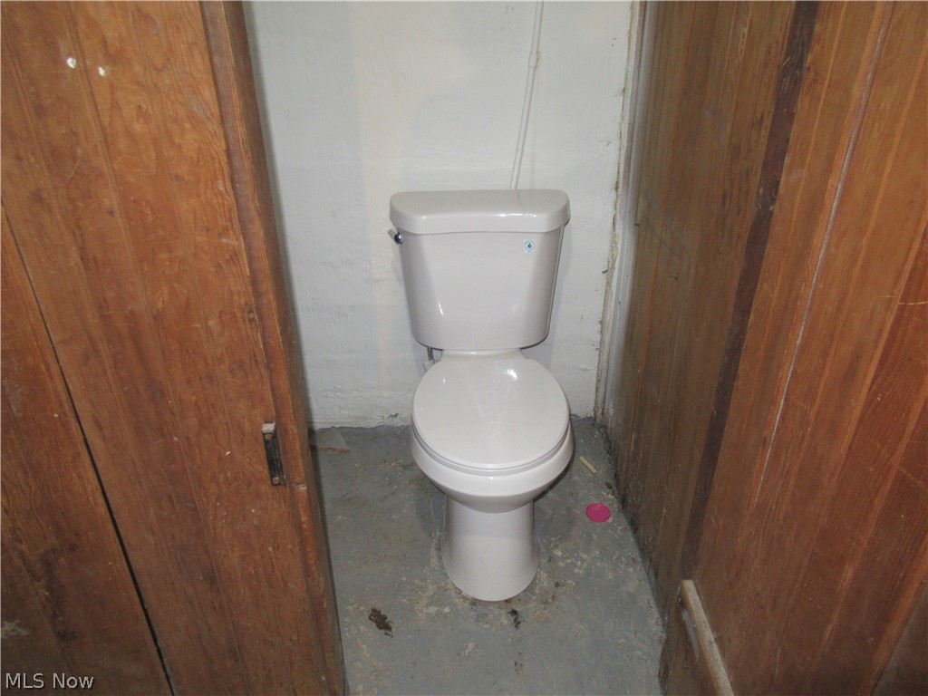 3824 East Antisdale Road Cleveland, OH 44118 - Photo 26 of 27 White two-piece toilet with a round bowl, set against a white painted wall