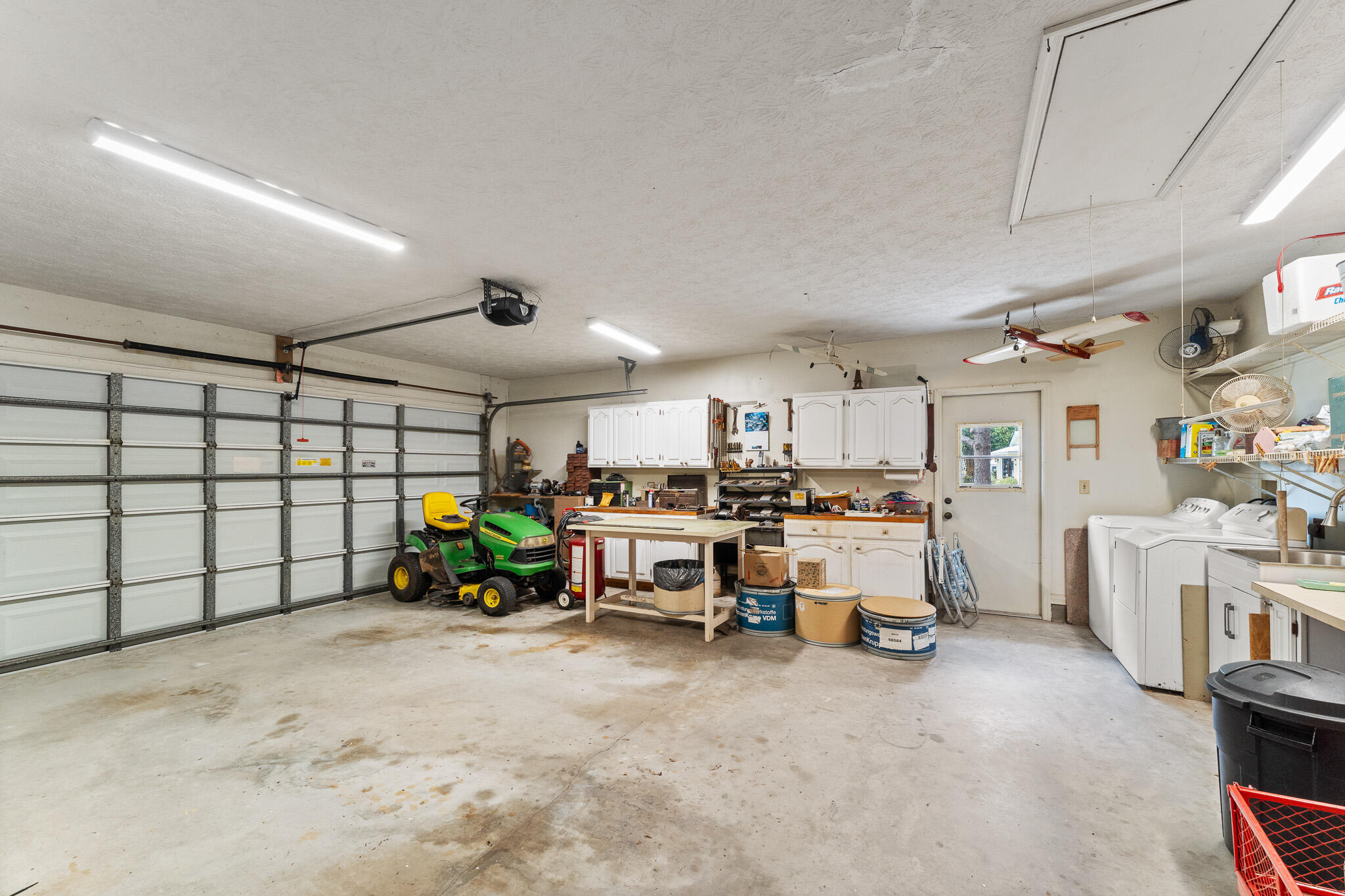 1653 Southwest 85th Terrace Stuart, FL 34997 - Photo 49 of 54 a view of a room with furniture and a garage