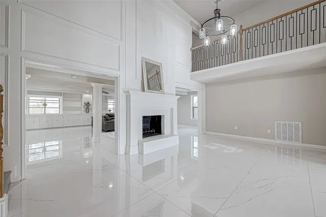 a view of a dining room with furniture wooden floor and chandelier