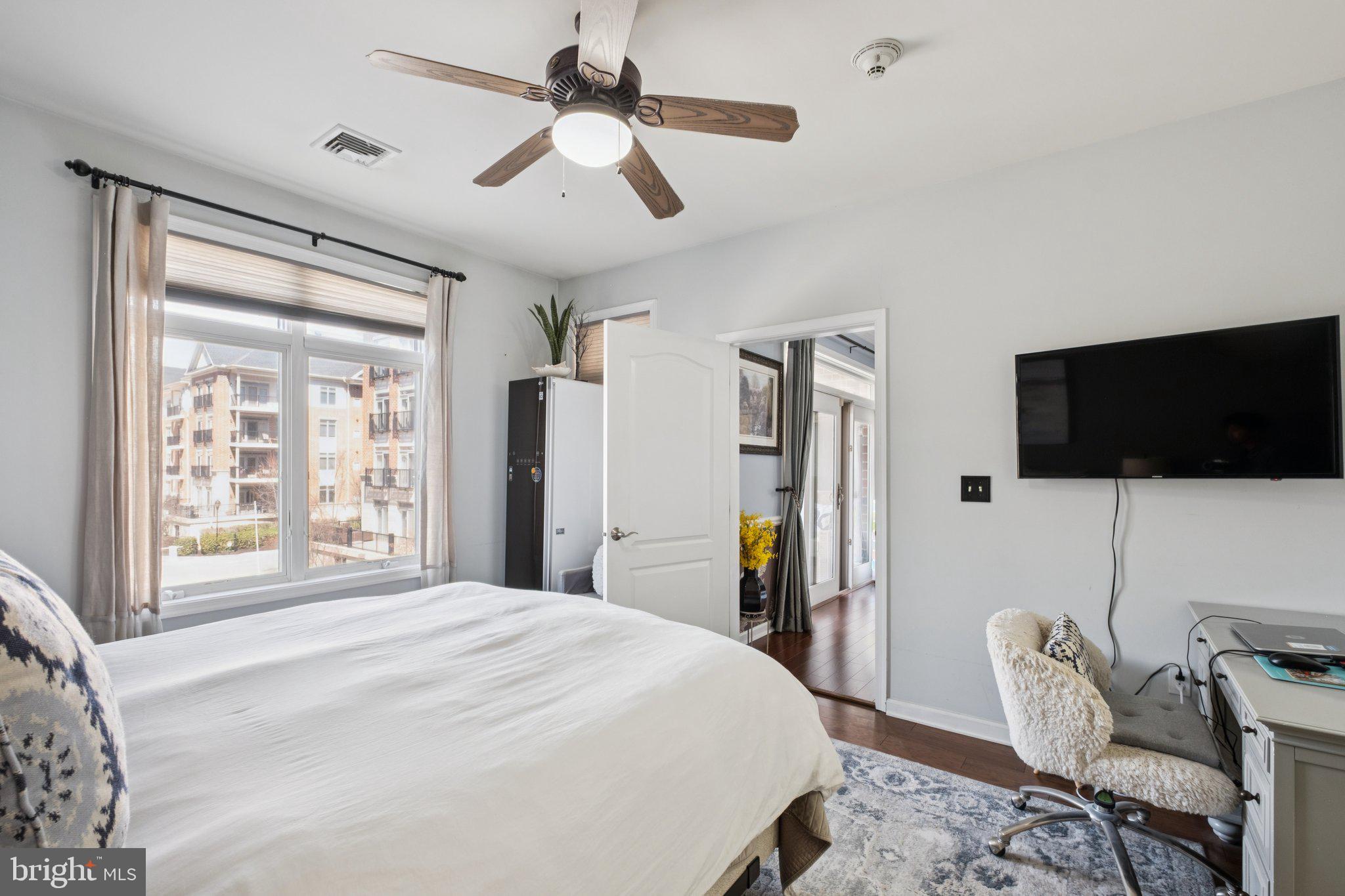 309 Carson Terrace Huntingdon Valley, PA 19006 - Photo 29 of 44 a bedroom with a bed a flat screen tv and a window