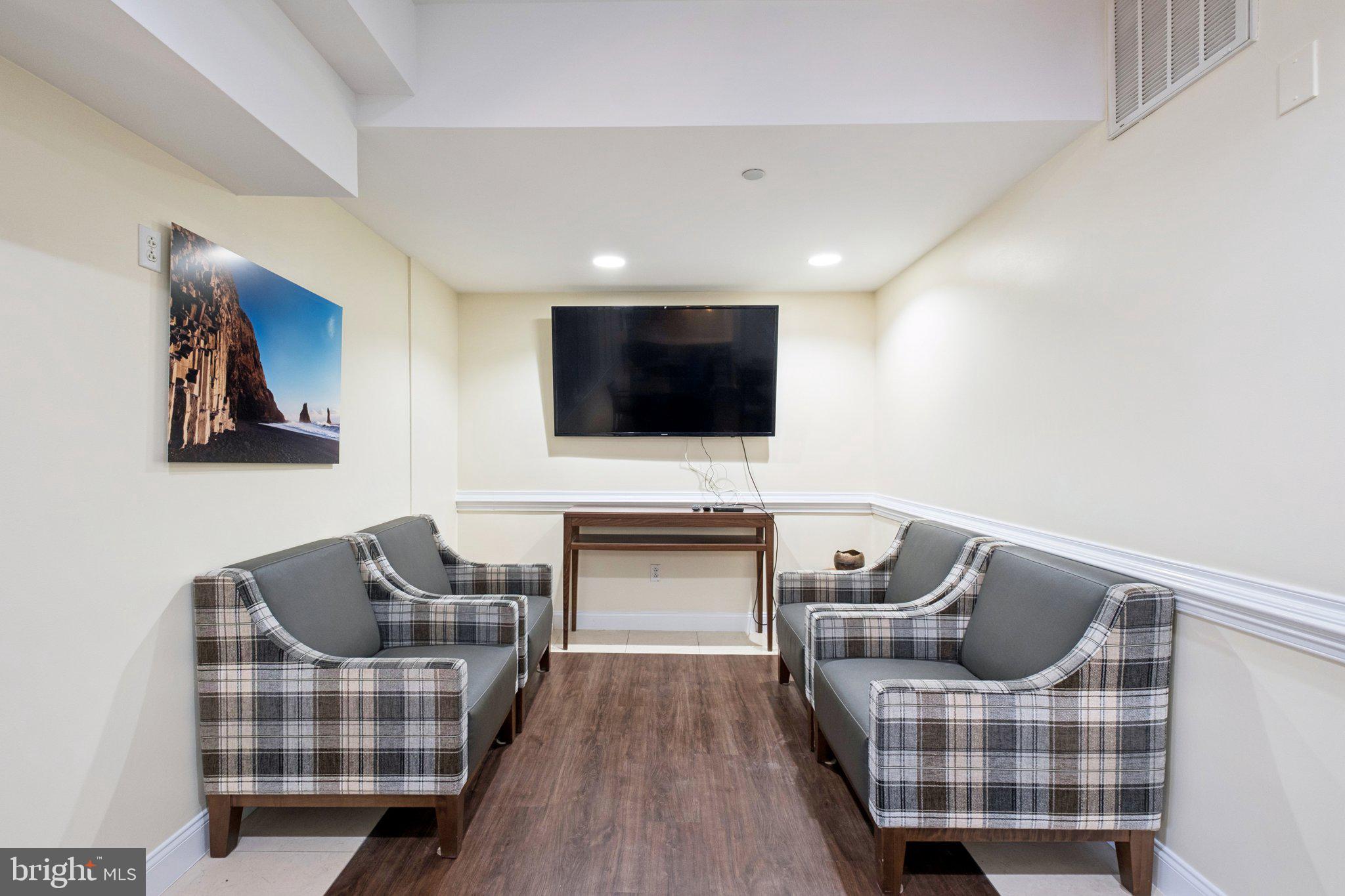 309 Carson Terrace Huntingdon Valley, PA 19006 - Photo 43 of 44 a living room with furniture and a flat screen tv