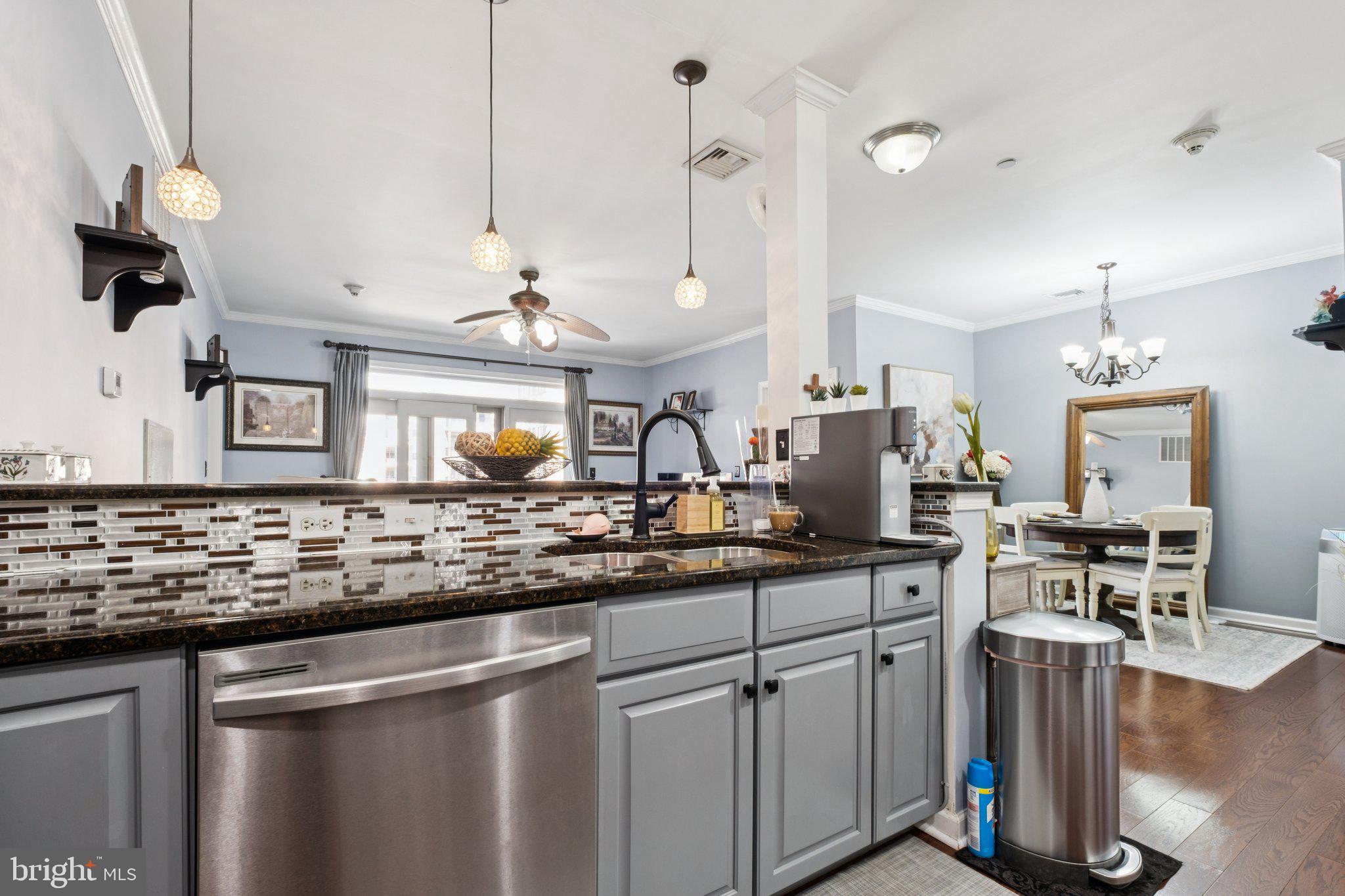 309 Carson Terrace Huntingdon Valley, PA 19006 - Photo 6 of 44 a kitchen with stainless steel appliances granite countertop a sink a stove and a wooden floors