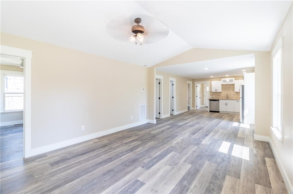 96 Orchard Road Summerville, GA 30747 - Photo 11 of 14 a view of a room with wooden floor and a ceiling fan