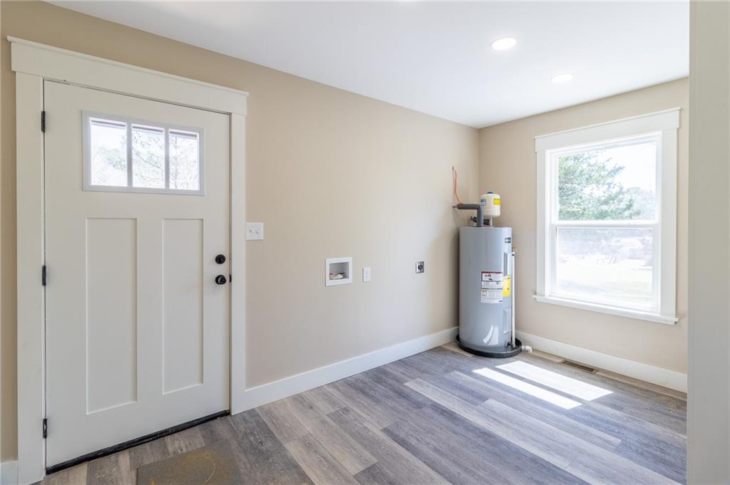 96 Orchard Road Summerville, GA 30747 - Photo 12 of 14 an empty room with wooden floor and windows