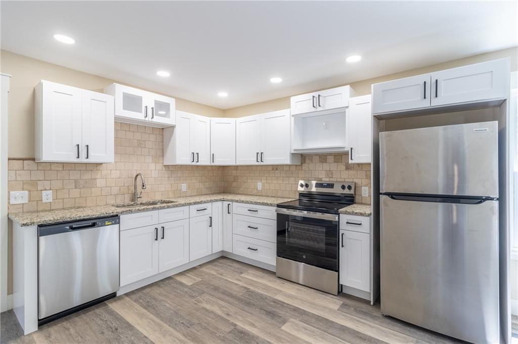 96 Orchard Road Summerville, GA 30747 - Photo 3 of 14 a kitchen with stainless steel appliances granite countertop a refrigerator sink and cabinets