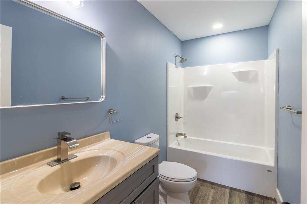 96 Orchard Road Summerville, GA 30747 - Photo 6 of 14 a bathroom with a sink toilet and shower