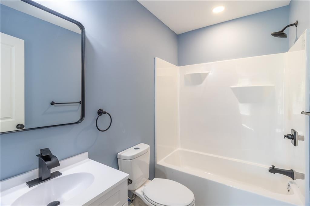 96 Orchard Road Summerville, GA 30747 - Photo 9 of 14 a bathroom with a sink toilet and shower