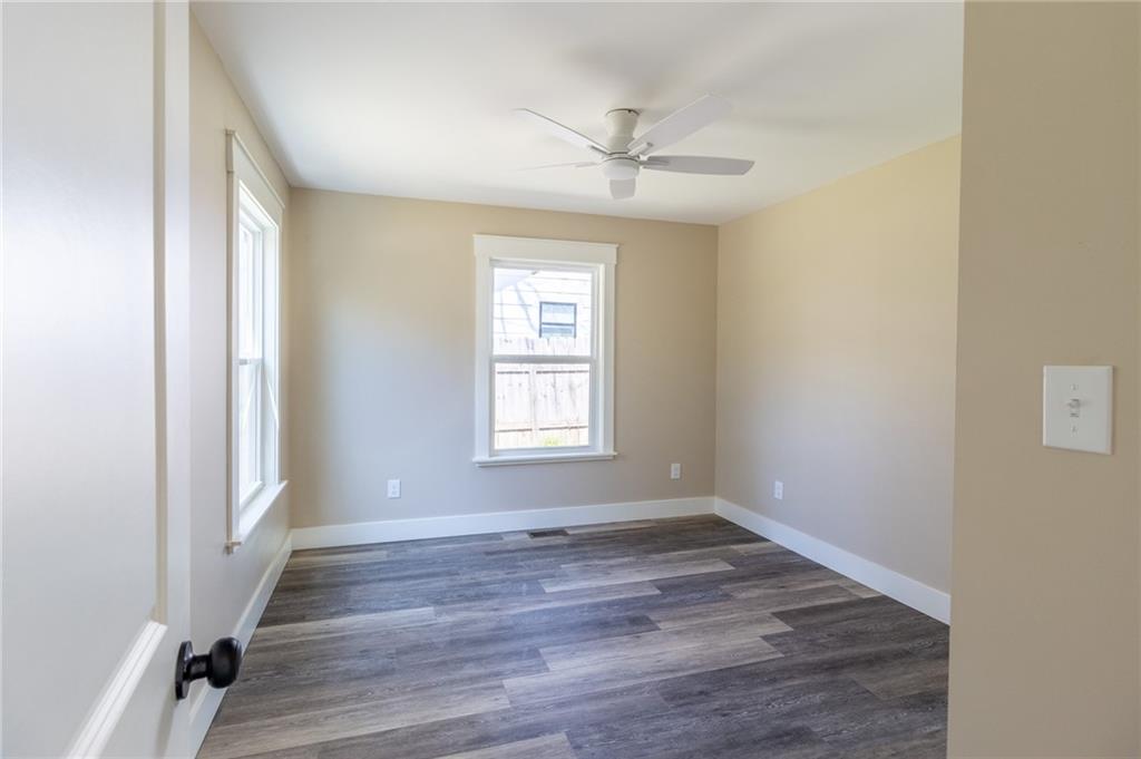 96 Orchard Road Summerville, GA 30747 - Photo 10 of 14 a view of an empty room with wooden floor and a window