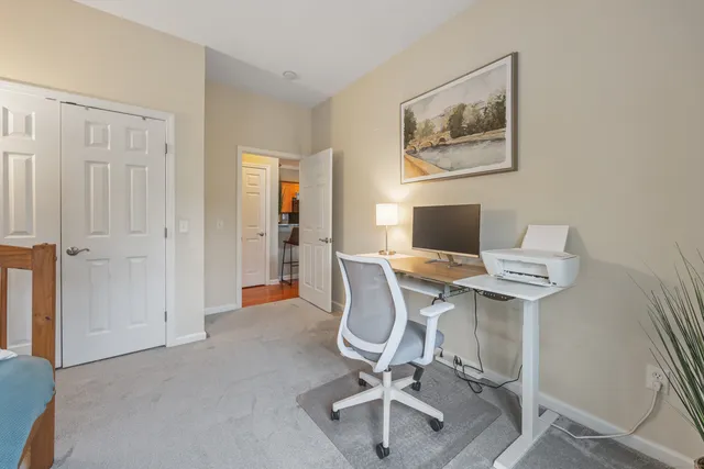 a workspace with furniture and chandelier