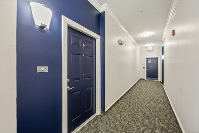 a swimming pool with trees in the background