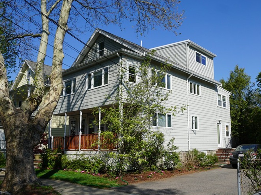 38 Lafayette Street, Unit 38 Arlington, MA 02474 - Photo 1 of 13 a front view of a house with a yard