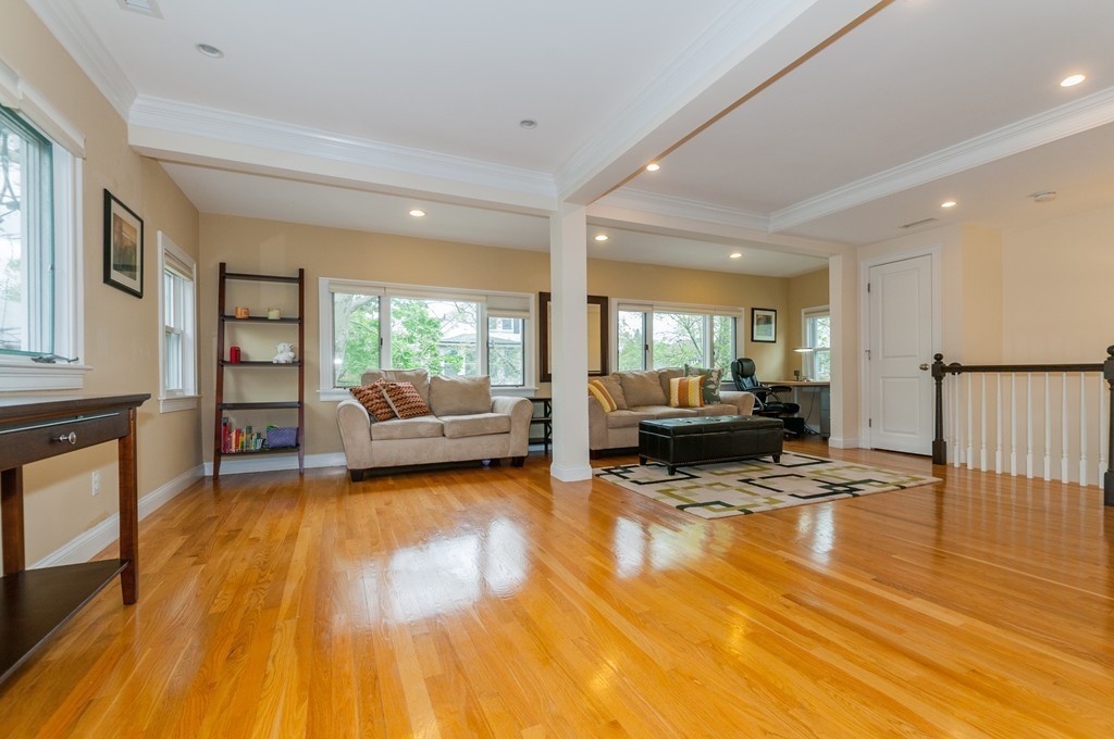 38 Lafayette Street, Unit 38 Arlington, MA 02474 - Photo 4 of 13 a living room with furniture and a wooden floor