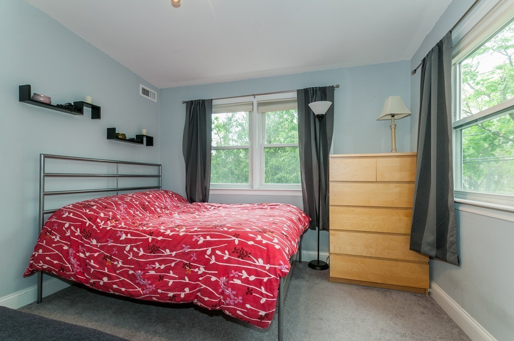 38 Lafayette Street, Unit 38 Arlington, MA 02474 - Photo 7 of 13 a bedroom with a bed and a window