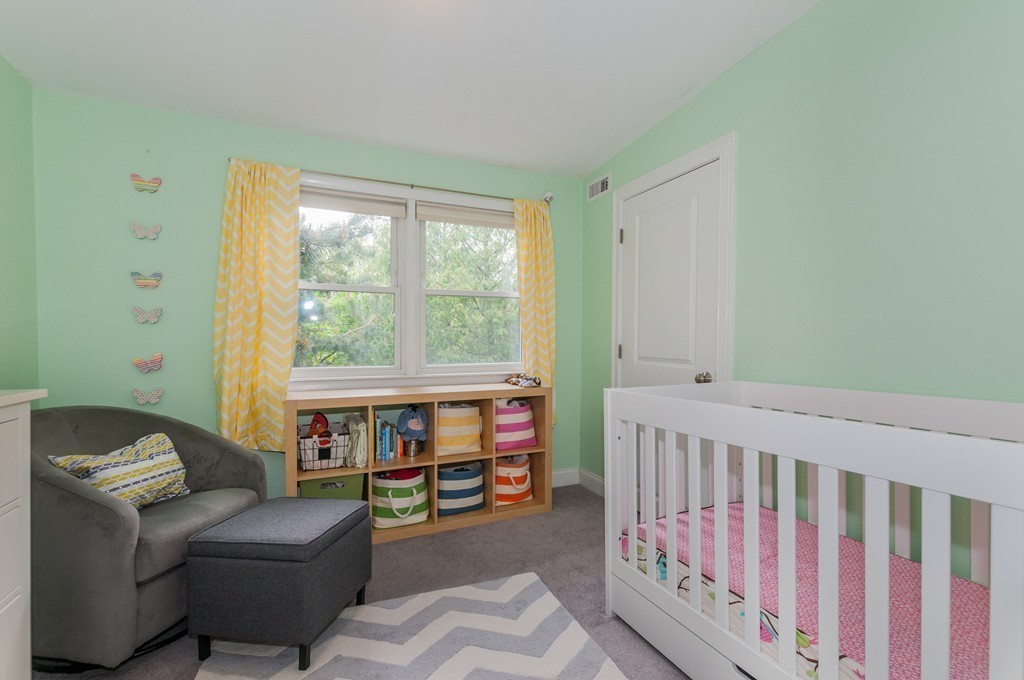38 Lafayette Street, Unit 38 Arlington, MA 02474 - Photo 8 of 13 a bedroom with furniture and a window