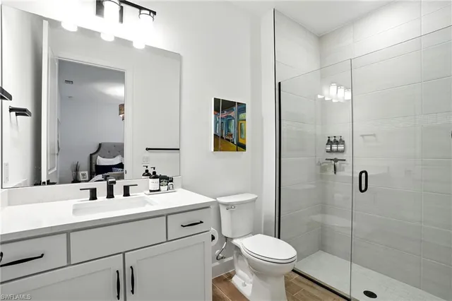 a bathroom with a sink toilet and shower