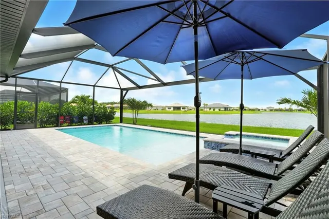 a view of a swimming pool with a patio