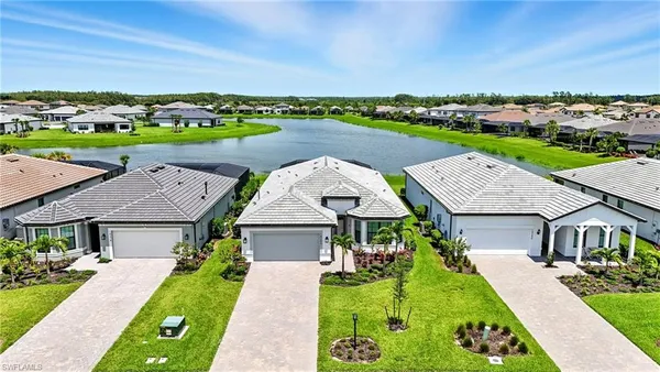 an aerial view of a house with swimming pool garden and outdoor seating