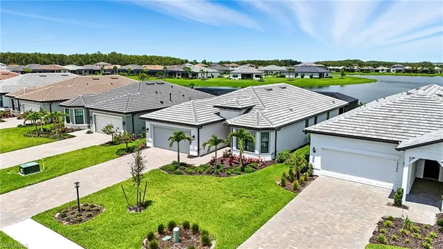 an aerial view of a house with garden space and street view