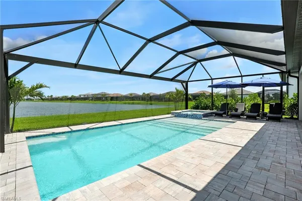 a view of swimming pool with a yard