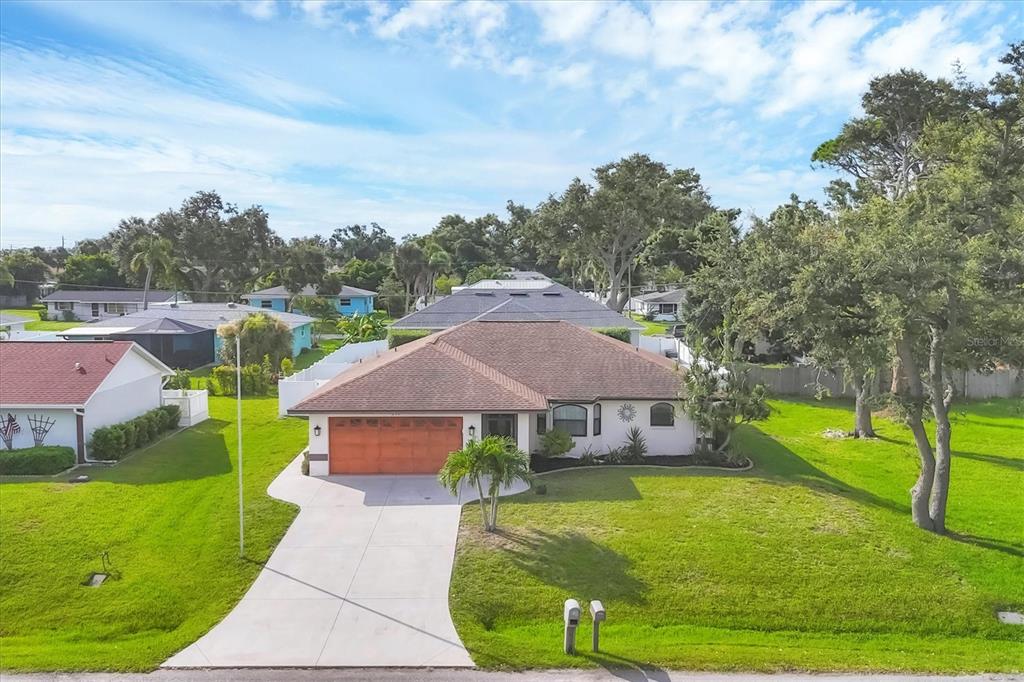 291 Crane Road Venice, FL 34293 - Photo 1 of 1 a view of house with garden space and street view