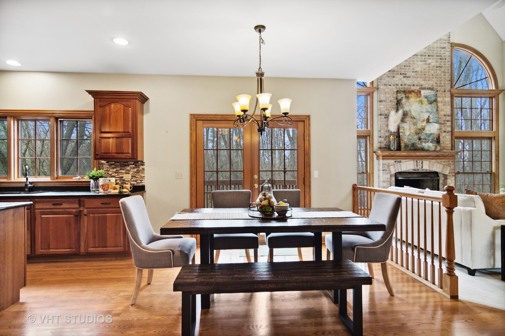 902 Bridle Lane Cary, IL 60013 - Photo 11 of 60 a dining room with furniture a chandelier and wooden floor
