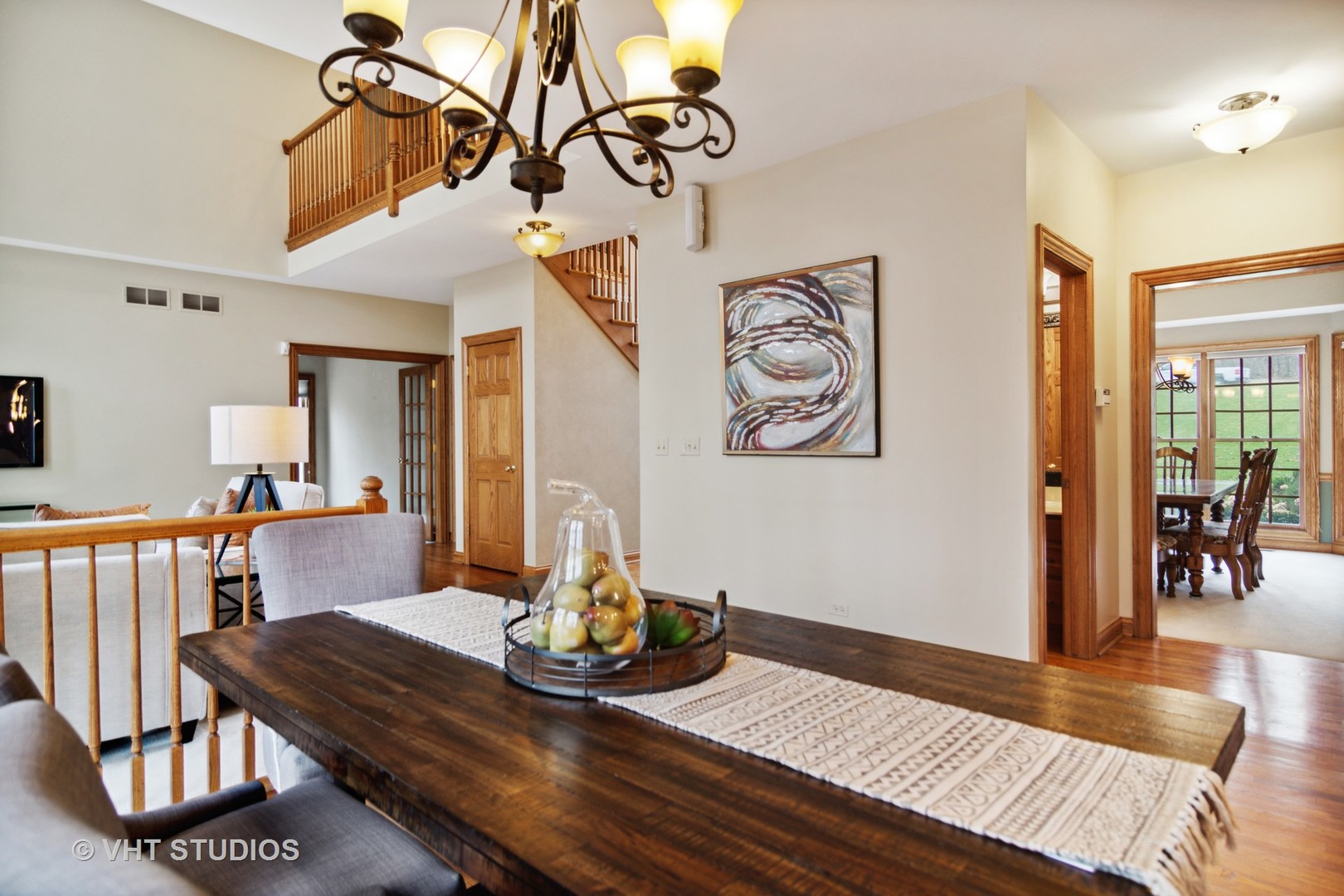 902 Bridle Lane Cary, IL 60013 - Photo 12 of 60 a view of a dining room with furniture wooden floor and chandelier