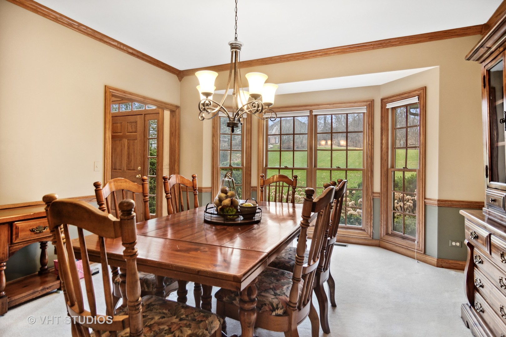 902 Bridle Lane Cary, IL 60013 - Photo 14 of 60 a view of a dining room with furniture window and outside view