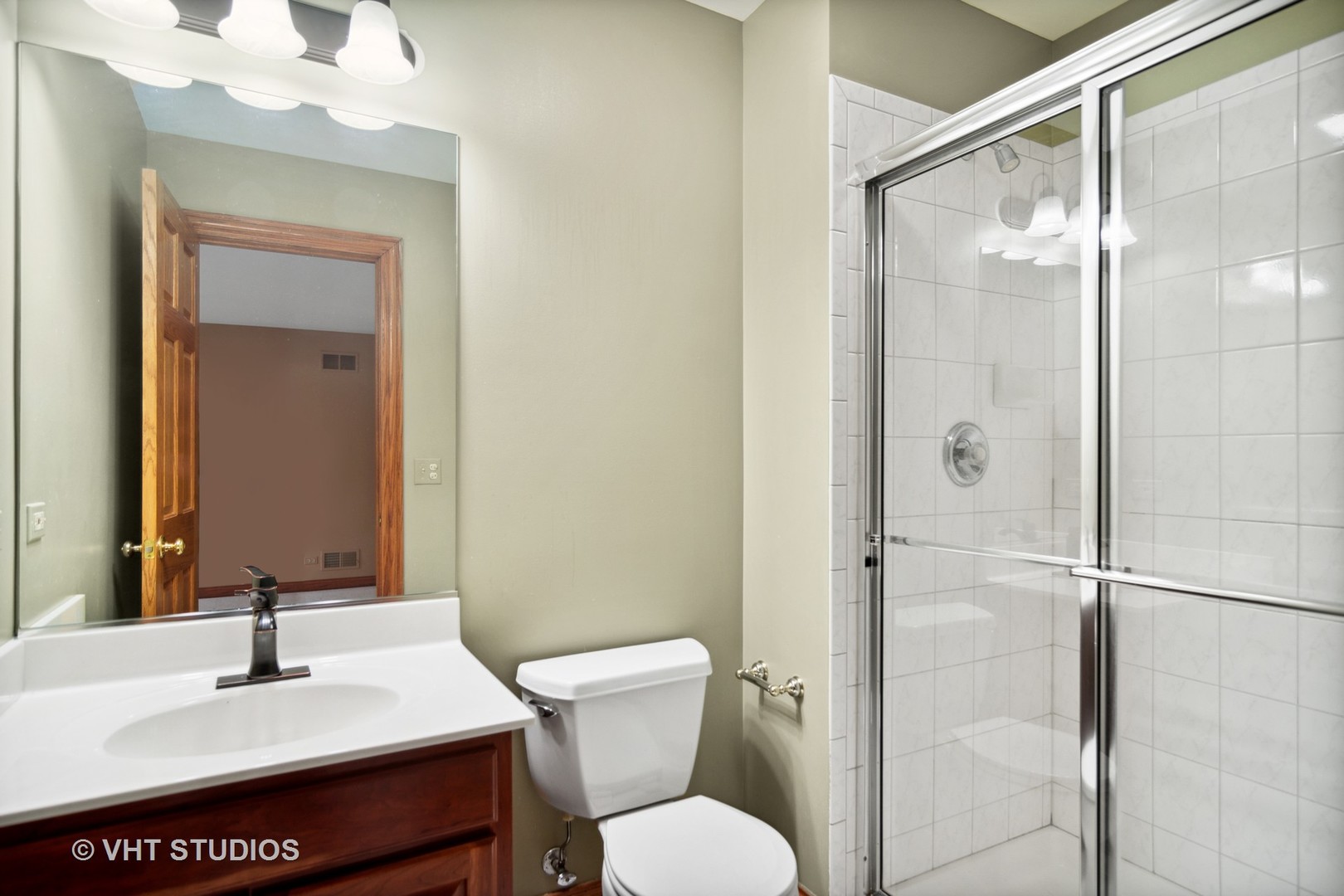 902 Bridle Lane Cary, IL 60013 - Photo 31 of 60 a bathroom with a sink toilet and shower